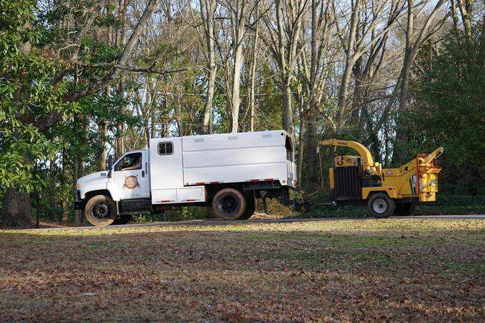 Chip truck and chipper on a job