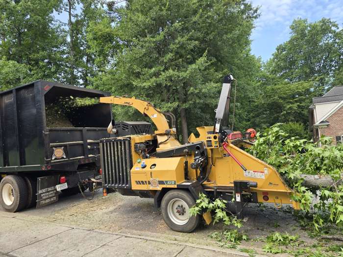Chipper and chip truck on a job